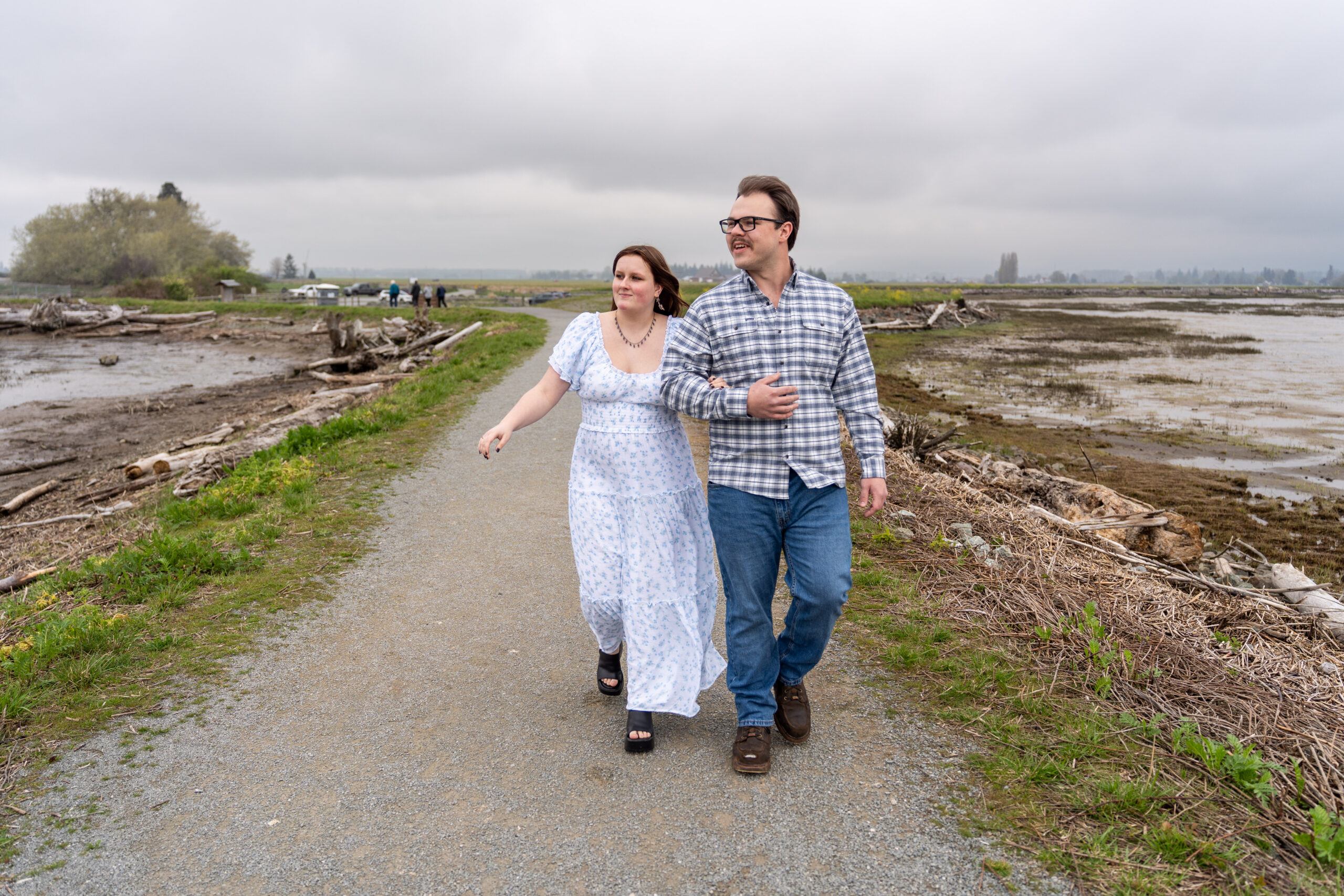 Engaged couple at their engagement photo shoot at Fir Island Wildlife Preserve, Skagit County, Washington.